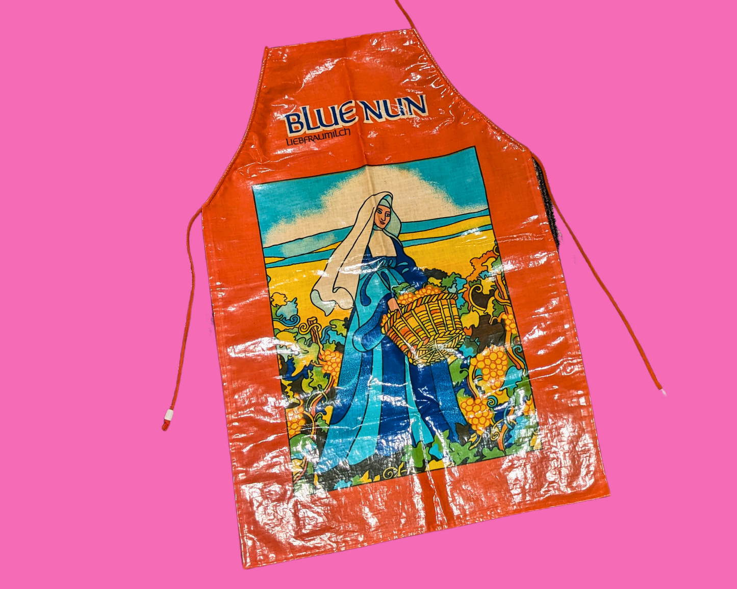 Tablier en plastique vintage des années 1990 représentant une nonne bleue