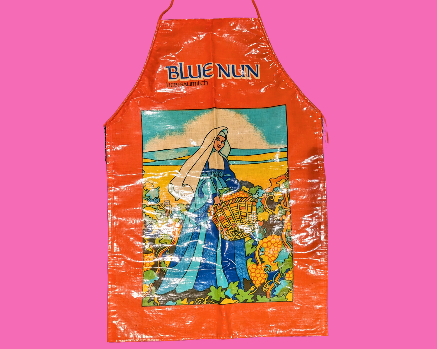Tablier en plastique vintage des années 1990 représentant une nonne bleue