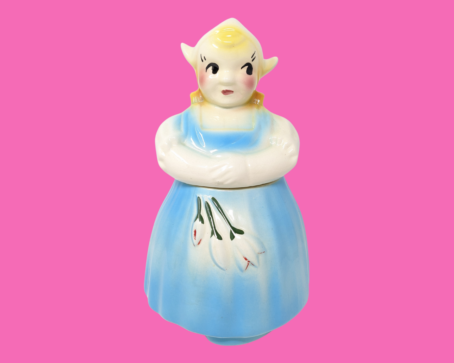 Petite fille danoise vintage des années 1970 dans un pot à biscuits en robe bleue