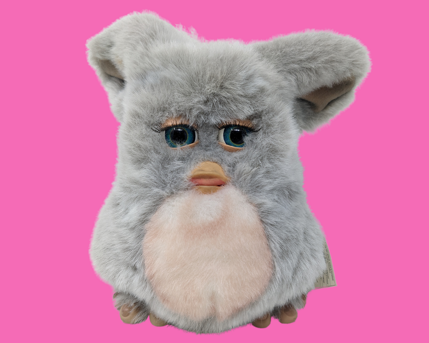 Jouet Furby pelucheux gris rétro